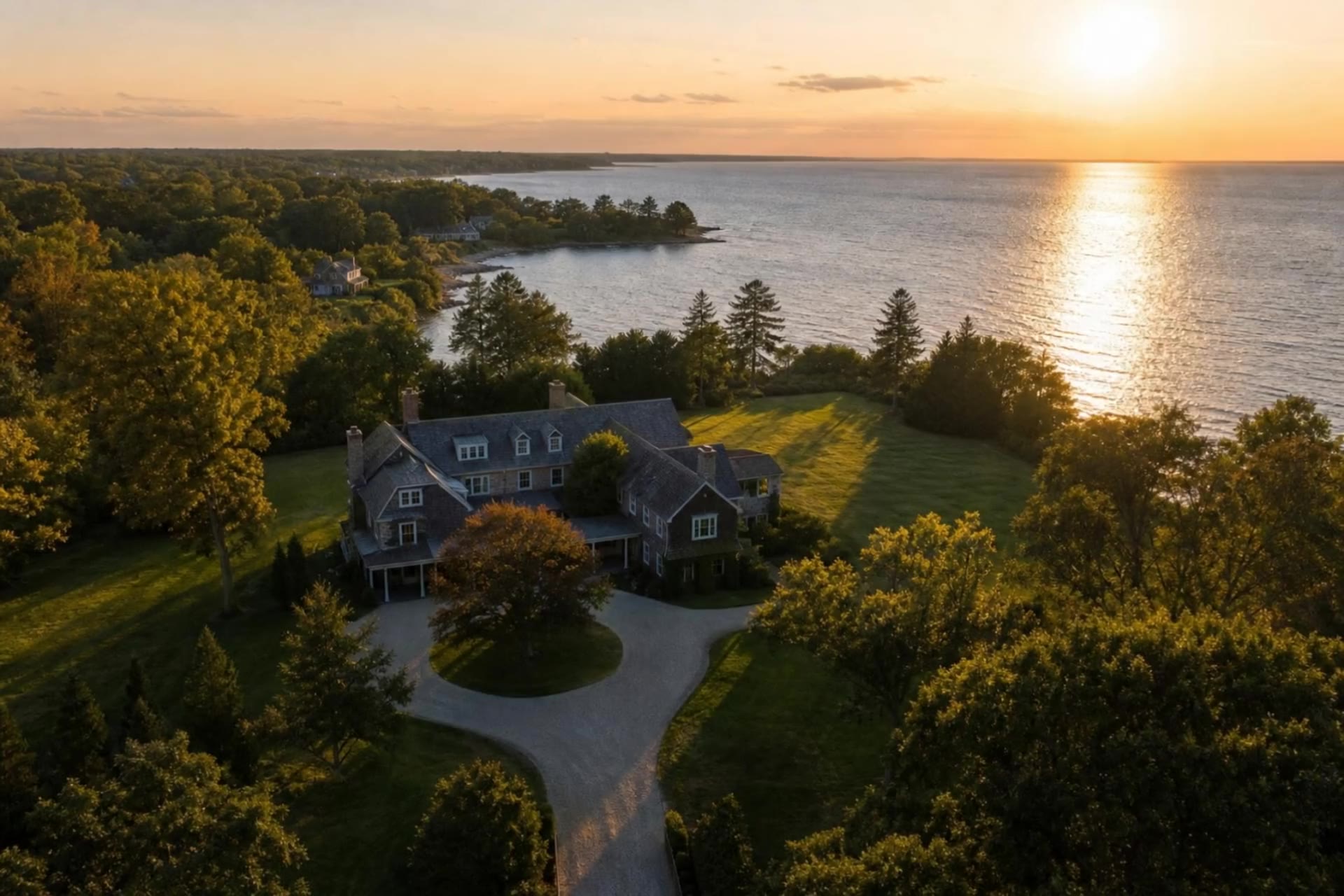 Aerial view of a waterfront estate on Long Island's North Shore at golden hour, AI-generated concept imagery